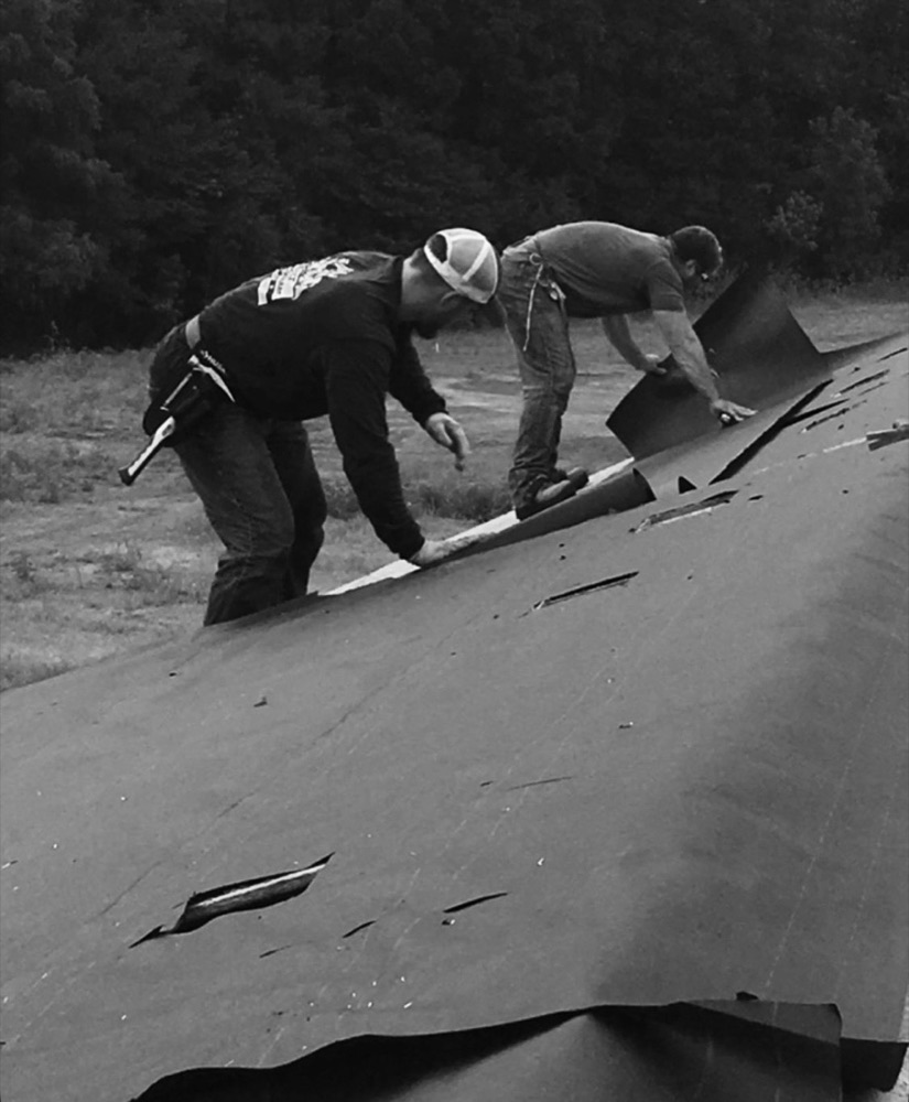 The founder and his son roofing together in 2017
